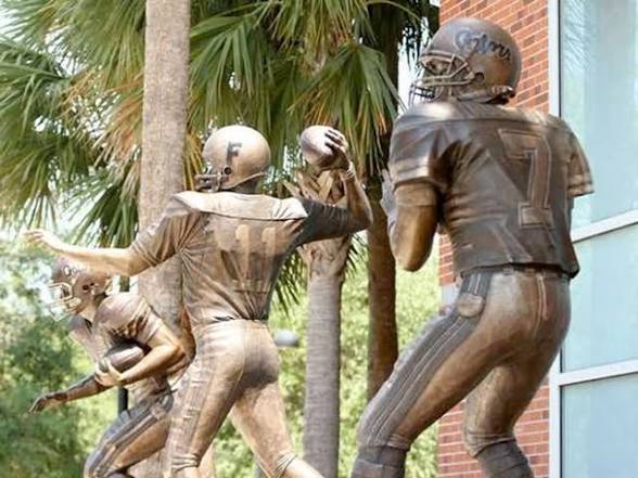 Bronze statue figures in the Florida Heisman plaza, supplied reference photograph